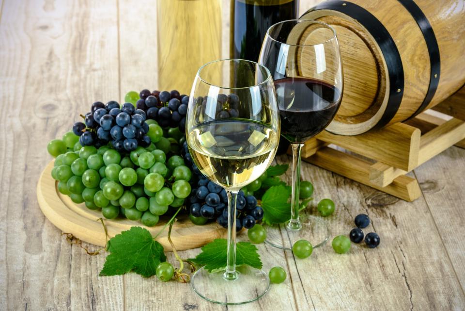 two glasses of natural wine on a wooden table