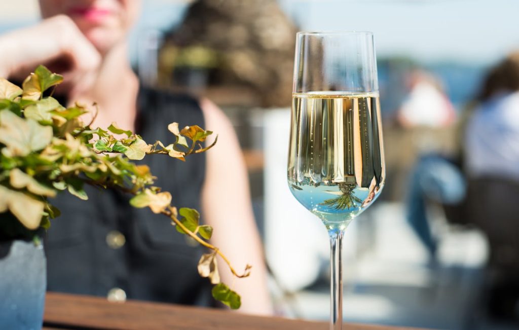 Fluted glass filled with white wine