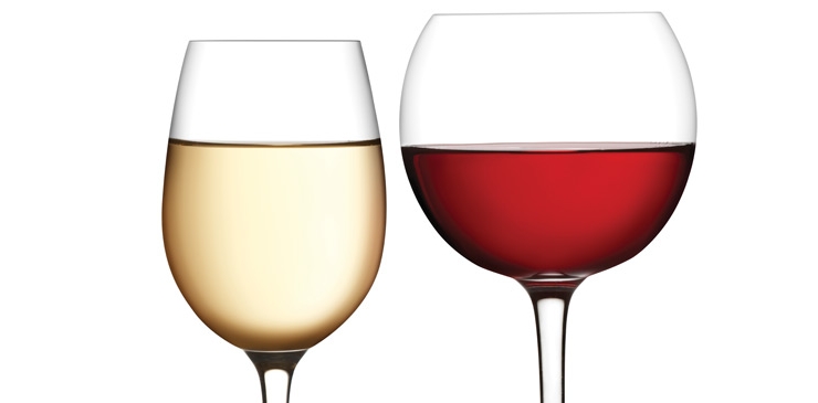 White wine glass (left) fairly full and red wine glass (right) half full