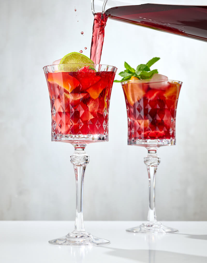 wine poured into fresh fruit to turn into dewy sangria